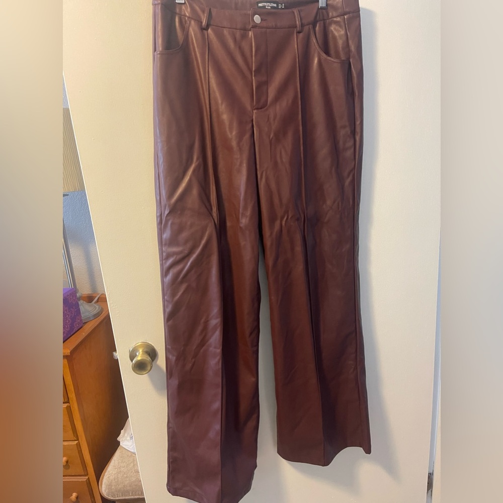 PrettyLittleThing wide leg faux leather trousers.